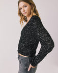Side view of woman wearing Chaser’s Sparrow True Black Button-Up Long Sleeve on a white background