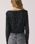 Back view of woman wearing Chaser’s Sparrow True Black Button-Up Long Sleeve on a white background