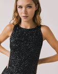 Front view of woman wearing Chaser’s Faye True Black Dress on a white background