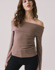 Front view of woman wearing Chaser’s Pixie Deep Taupe Long Sleeve with off-shoulder design on a white background