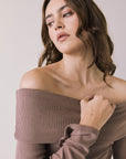 Front view of woman wearing Chaser’s Pixie Deep Taupe Long Sleeve with off-shoulder design on a white background