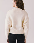 Back view of woman wearing Chaser’s Warm White Luck Zip Up Cardigan Sweater on a white background