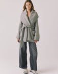 Full body view of woman wearing Chaser’s Eclipse Heather Grey Cardigan Robe styled with blue jeans on a white background