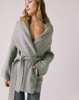 Front view of woman wearing Chaser’s Eclipse Heather Grey Cardigan Robe with blue jeans on a white background