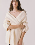 Front view of woman wearing Chaser’s Eclipse Warm White Cardigan Robe on a white background