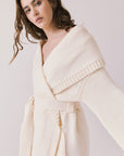 Side view of woman wearing Chaser’s Eclipse Warm White Cardigan Robe on a white background