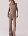 Full body view of woman wearing Chaser’s Deep Taupe Mantra Legging with matching Porta Deep Taupe Long Sleeve on a plain background