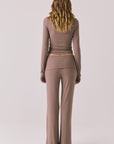 Full body back view of woman wearing Chaser’s Deep Taupe Mantra Legging with matching Porta Deep Taupe Long Sleeve on a plain background