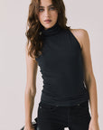 Front view of woman wearing Chaser’s Hailee Black Tank on a white background