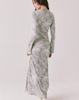 Full body back view of woman wearing Chaser’s light Opal Python Print Maxi Dress with long sleeves and relaxed fit against a white background