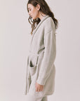 Side view of woman wearing Chaser’s Cozy Heather Grey Robe with tie waist on a white background
