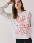 Front view of woman wearing Chaser’s Spirits Bright Light Grey Long Sleeve with red graphics and text on a light gray background