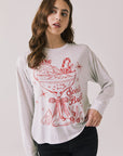 Front view of woman wearing Chaser’s Spirits Bright Light Grey Long Sleeve with red graphics and text on a light gray background