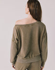 Back view of a woman wearing Chaser's Bellini Ginger Brown Pullover and matching pants on a white background