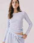 Front view of woman wearing Chaser’s Spritz Long Sleeve on a white background