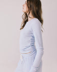 Side view of woman wearing Chaser’s Spritz Long Sleeve on a white background