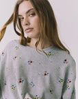 Chaser Terra Heather Grey Ditsy Embroidery Pullover close up showcasing multicolor ditsy floral embroidery on textured knit