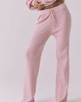 Front view of the Chaser Sailor Pink Salt Joggers in Pink Salt featuring a ribbed texture and drawstring against a plain backdrop