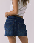 Back view of the Chaser Sloane Mini Skirt in Indigo Wash showing pocket placement and clean denim finish
