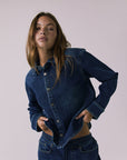 Chaser All Day Indigo Wash Button Down in Indigo Wash shown in a dynamic front angle emphasizing the easy fit and snap-front closure