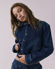 Chaser All Day Indigo Wash Button Down in Indigo Wash captured in a soft studio close-up with textured denim and snap-button detailing