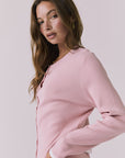 Side view of Chaser Seaport Pink Salt cardigan showing ribbed knit structure and soft drape with matching joggers