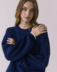 Close-up front view of the Chaser Rhode Worn Blue Pullover highlighting the ribbed fabric and crew neckline