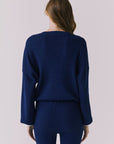 Back view of the Chaser Rhode Worn Blue Pullover showing the ribbed texture and relaxed back fit