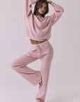 Full body view of the Chaser Sailor Pink Salt Joggers styled with the matching Rhode Pink Salt Pullover on a neutral studio background