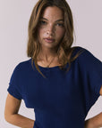 Close-up front view of the Chaser Porter Midi Dress in Worn Blue highlighting the ribbed knit fabric and neckline detail