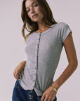 Front view of a woman wearing Chaser's heather gray button-up Anchor Tee against a plain background