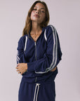 Close view of the Chaser Abilene Sapphire Zip Up focusing on the zipper and striped sleeves