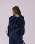 Chaser Abilene Sapphire Zip Up shown from behind with the draped hood and sleeve stripes visible