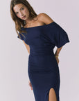 Chaer June Maxi Dress in Navy angled front view highlighting the draped neckline gathered waist and fluid skirt movement