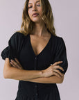 Chaser Abbie Black Blouse in a close up view focused on neckline and sleeve details