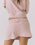 Chaser Soleil Honey Peach Mini Skort styled with the matching Campbell Pullover showcasing a clean back silhouette and soft drape