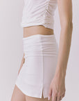 Chaser Rue White Skort in White showcasing a clean back silhouette with subtle side slit detail