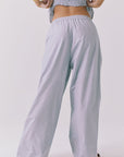 Back view of the Chaser Dorit Pinstripe Trousers showing the easy pull on fit elastic waistband and clean wide leg finish