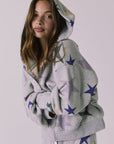 Hood up view of the Chaser You’re A Star Zip Up Hoodie in Heather Grey highlighting the soft fleece texture and oversized sleeves