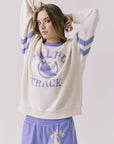 Chaser Malibu Track Long Sleeve in Starry White highlighting distressed Malibu Track print and contrast Soft Blue neckline detail