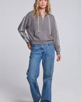 Model wearing Chaser's Soft Graphite Emily Zip-Up and matching Delilah Track Pants in Soft Graphite with contrast stripes, full-body view