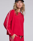 Model wearing Chaser's Cherry Bomb Anastasia Long Sleeve with contrast sleeve stripes, angled view