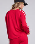 Model wearing Chaser's Cherry Bomb Anastasia Long Sleeve with contrast sleeve stripes, back view