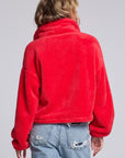 Model wearing Chaser's Cherry Zip-Up in Cherry Bomb red plush zip-up jacket with high collar, back view