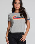 Back view of a woman wearing the Chaser California Dreamin Tee and black jeans on a neutral background