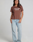 A full body front view of a woman wearing the Chaser Cute Buttired Top on a neutral background