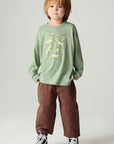 A full body front view of a boy wearing the Chaser Dino Action Boys Tee on a neutral background
