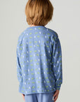 Back view of a boy wearing the Chaser Dino Bolts Boys Tee on a neutral background with pants