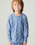Front view of a boy wearing the Chaser Dino Bolts Boys Tee on a neutral background with matching blue pants