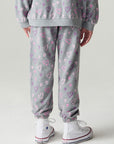 Back view of a girl wearing the Chaser Ditsy Hearts Girls Jogger on a neutral background